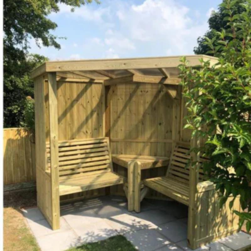 Churnet Valley Four Seasons garden room in natural wood with seat benches and a corner table