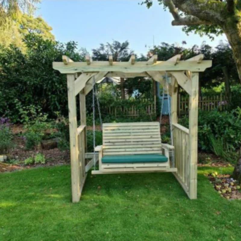 Churnet Valley Ophelia swing for two with wooden frame and green cushions, perfect for outdoor relaxation.