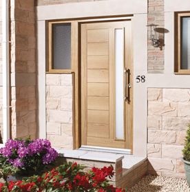 Oak external door with vertical panel design, side windows, and a sleek handle on a stone-walled entrance.