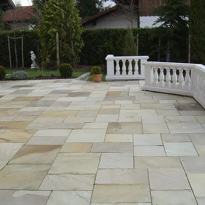Traditional mint fossil sandstone paving slabs, textured finish, suitable for patios and outdoor areas, Paveworld brand.