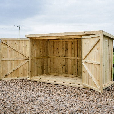 Wooden chipping bike store with double doors, suitable for outdoor use, available in small and large sizes by The Garden Vil