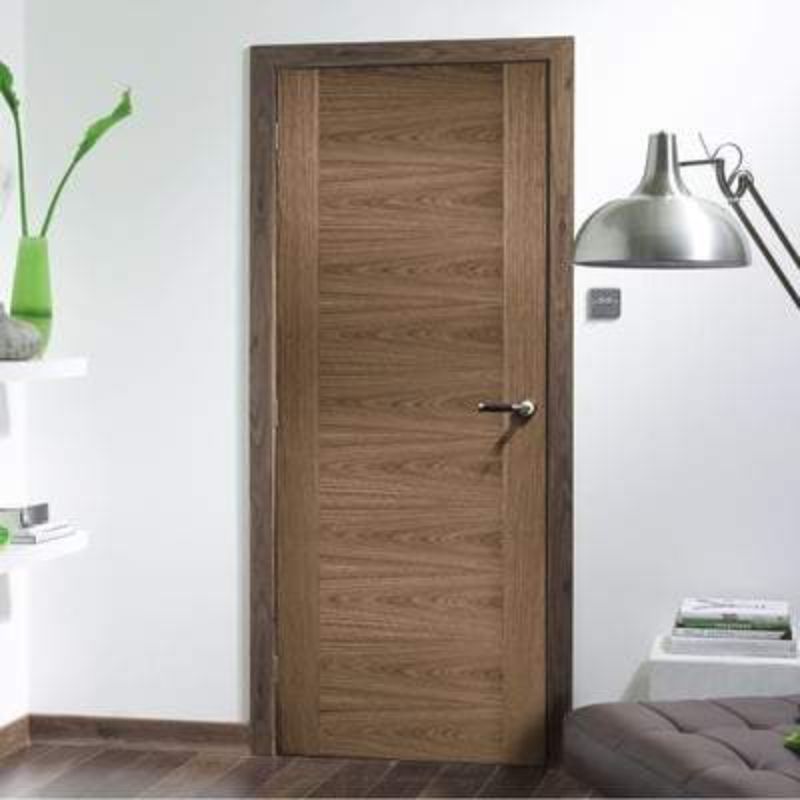 Walnut pre-finished interior door with modern panel design, suitable for various room sizes by LPD Doors.