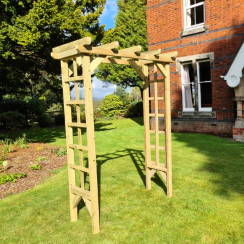 Natural wood rose arch by Churnet Valley, 4ft tall with a slatted design ideal for climbing plants.