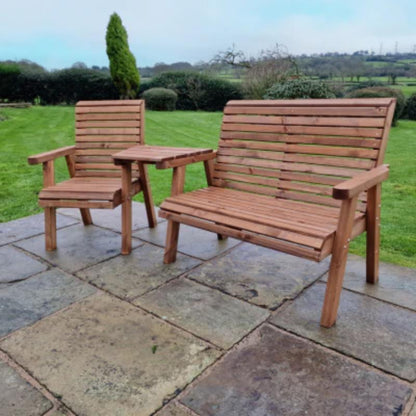 Churnet Valley Trio Set angled garden chairs made from natural wood, featuring slatted design and matching side table.