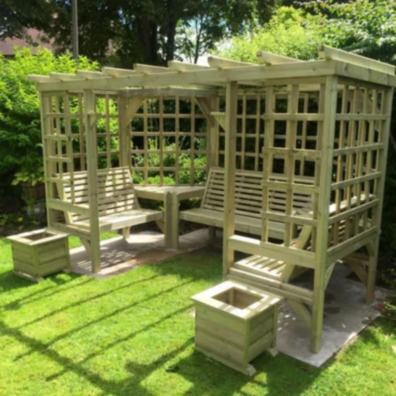 Churnet Valley Riviera Arbour with wooden lattice design, built-in seating, and planters in a garden setting.